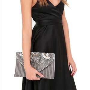 Beaded clutch with strap